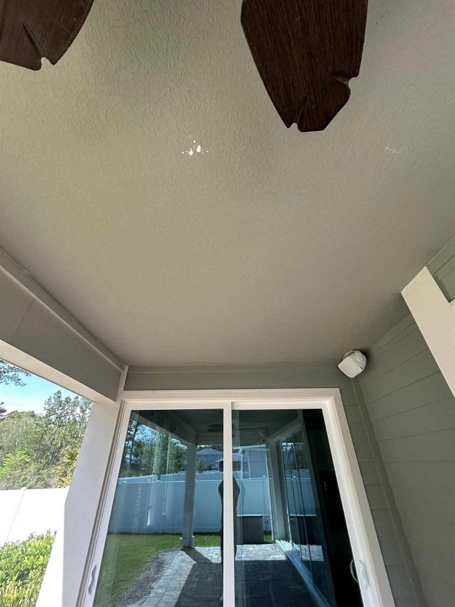 Lanai ceiling after cleaning: even, clean grey-green paint