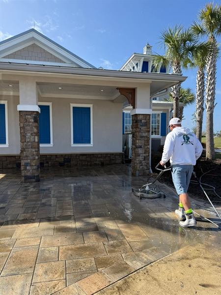 Pressure washing a large stamped-concrete patio