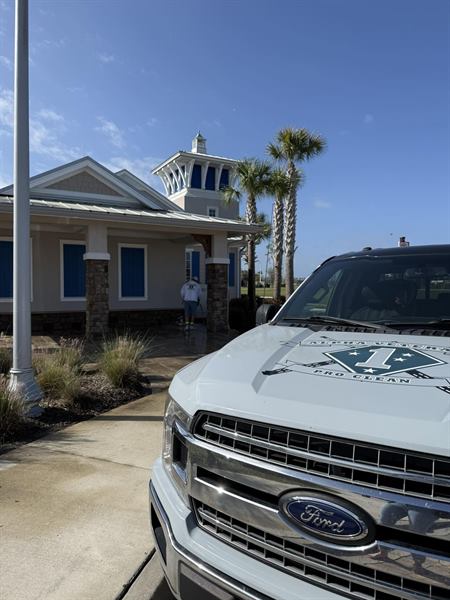 The Alpha Veterans Pro Clean truck, with the company emblem on the hood, parked at a job